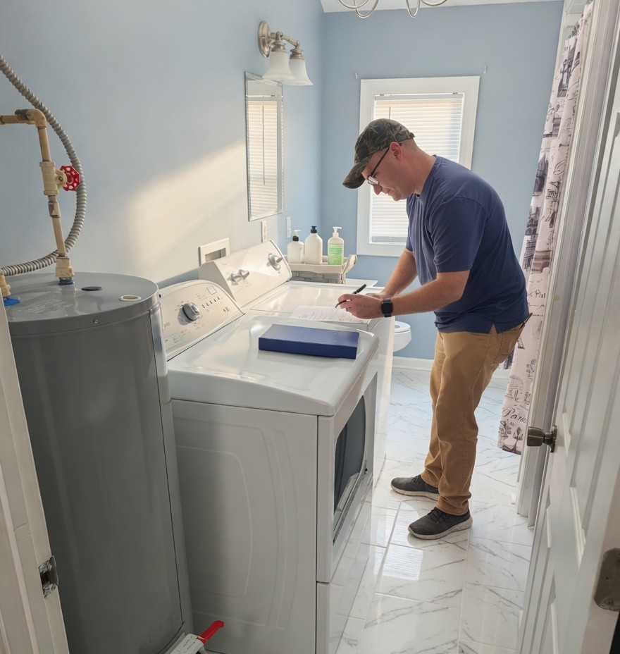 Professional EasySpin technician installing a washer and dryer in a Chester, VA home